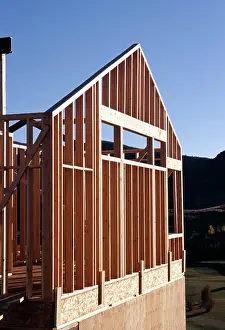 Beginnings Prints: Low angle view of house under construction