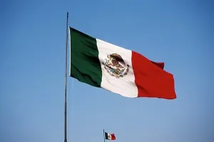 Identity Prints: Low angle view of two Mexican flags