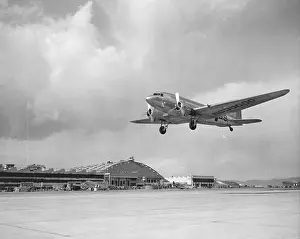 Runway Prints: Low angle view of a military airplane landing, Douglas DC-3