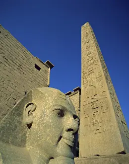 Sandstone Prints: Low angle view of a statue, Ramses II, Temple of Luxor, Luxor, Egypt
