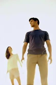 Medium Length Hair Prints: Low angle view of a young couple standing