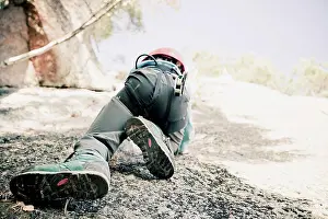 Dangerous Prints: Low section of boy rock climbing