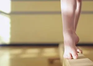 Agility Prints: Low section view of a female gymnast standing