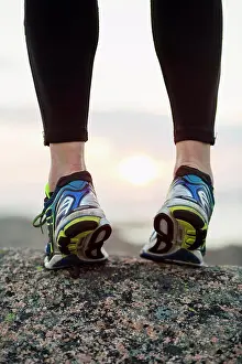 Out Door Prints: Low section of woman in sports shoes standing on toes outdoors
