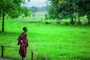 East Africa Prints: Maasai warrior stands guard, Mizumi Safari Park, Tanzania, East Africa, Africa