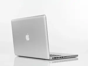 Electronics Prints: Macbook Pro laptop computer rear view with Apple logo on the lid isolated on white background