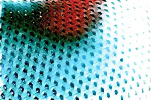 Textile Prints: Macro shot of a mesh-like wavy red bright blue surface with holes