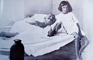 Daughter Prints: Mahatma Gandhi during a hunger strike is accompanied by Indira (Nehru) Gandhi