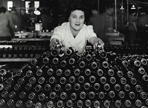 Guns Prints: Making The 'Besa' Gun -- A woman inspector with a batch of 'Besa' gun barrels