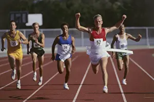 Runner Prints: Male athletes running on a running track