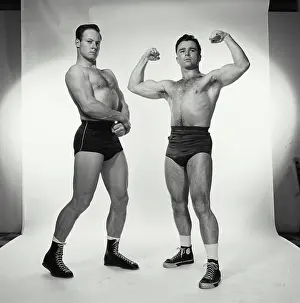 Macho Prints: Two male body builders flexing their muscles