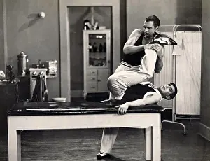 Human Foot Prints: Male contortionist stretching legs of a patient