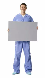 Physician Prints: Male doctor or nurse holding blank sign smiling