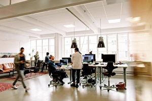 Connexions Prints: Male and female business colleagues working in creative office space