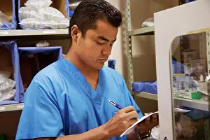 Sseditor Aa Prints: Male nurse making a list of medicine