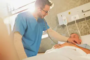 Tenacity Prints: Male nurse using stethoscope on patient in hospital bed