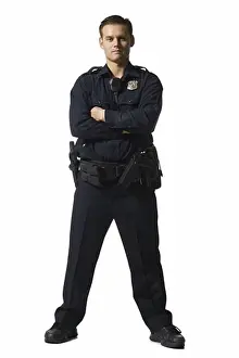 Model Release Prints: Male police officer standing with arms crossed