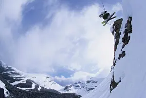 Dangerous Prints: Male skier drops cliff in Delirium Dive at Sunshine Village