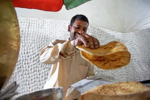 Packing Prints: Male vendor selling paratha at his roadside food stall