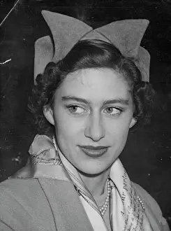 1950 Prints: Back From Malta - Princess Margaret wears a bow-front hat