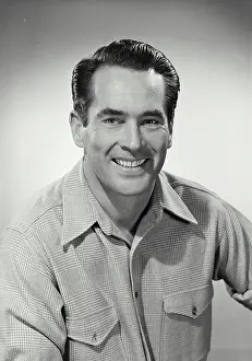Collared Shirt Prints: Man in button shirt smiling at camera