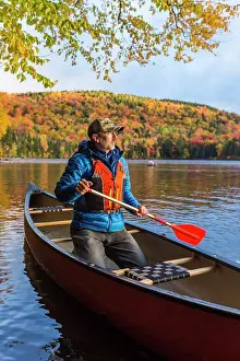 Adult Sonly Prints: A Man Canoeing On Greenough Pond In Fall At Wentworths Location, New Hampshire