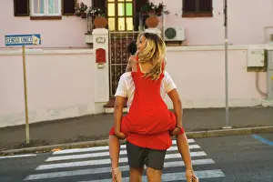 Anonymous Prints: Man carrying young girl on back