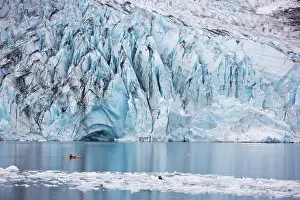 Paddle Prints: Man kayaking in Shoup Bay with Shoup Glacier in the background