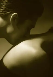 20 To 25 Years Prints: Man kissing the back and neck of woman in soft light