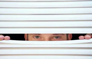 Mystery Prints: Man peeking through venetian blinds