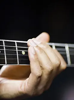 One Mid Adult Man Only Prints: man playing a guitar