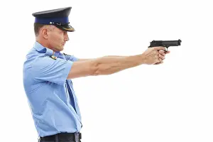 Detective Prints: Man, police officer and pointing gun ready to fire or shoot standing isolated on a white studio background