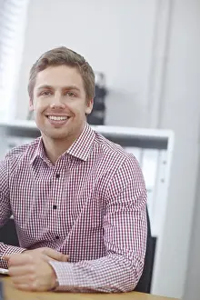 Files Prints: Man, portrait and happy in office on desk with proud for career growth as human resources manager