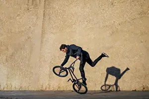 Bicycle Prints: Man practicing tricks with the bmx bike in the city
