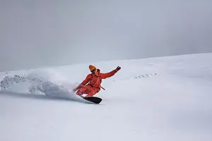 Adventure Prints: Man snowboarding on snowcapped mountain during vacation