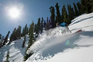 Colorado Prints: A man snowboards the Mount Axtel backcountry on a sunny Colorado day