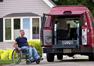 Boarding Prints: Man with spinal cord injury in a wheelchair getting in his accessible van