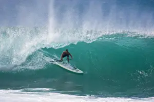 Paddle Prints: A man stand up paddle surfing, of the north shore of Oahu 02.12.08