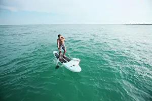 Balance Prints: A man Stand-Up paddleboards in the open ocean off Wrightsville Beach, NC