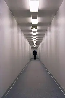 Ghic Prints: Man Standing at end of Long Hallway, Rear View