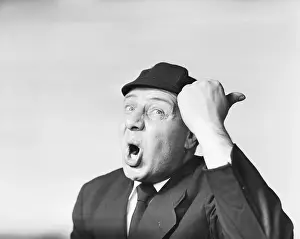Expressive Prints: Man in suit and cap making a funny surprised expression with hand gesture