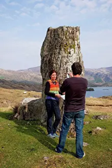 Visitor Prints: A Man Taking A Picture Of A Woman Beside A Rock Formation On The Coast Near Kenmare