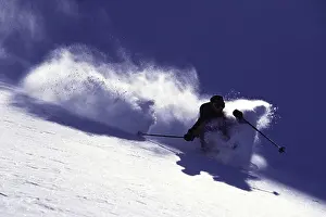 Difficult Prints: A man telemark skiing in the backcountry near Brighton, UT