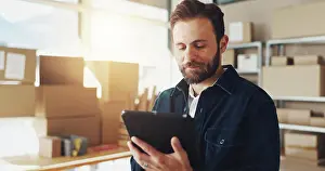 Network Prints: Man, typing and tablet with boxes for distribution of online orders