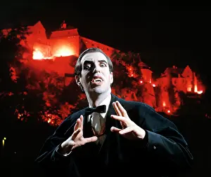 Threatening Prints: Man In Vampire Makeup And Costume Gesturing Menacingly Castle Background Studio Superstition Folklore