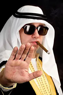 Smoking Prints: Man wearing a Sheikh costume and smoking a cigar