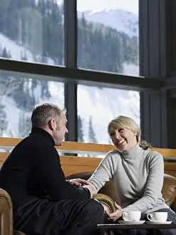 Thirty Prints: Man and woman chatting in a ski lodge