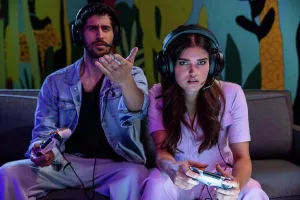 Positive Emotion Prints: Man and woman playing video games at home wearing headsets