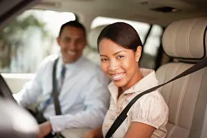30 To 35 Years Prints: Man and woman sitting in car smiling at the camera