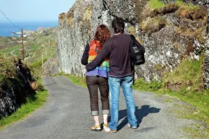Cork Prints: A Man And Woman Stand Looking At The View Of The Ocean Near Argroom, County Cork Ireland